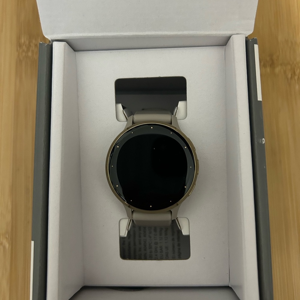 Garmin Gold and Black Smartwatch